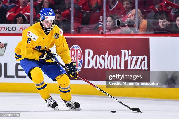 Rasmus Dahlin of Team Sweden skates the puck during the 2017 IIHF World Junior Championship bronze medal game against Team Russia at the Bell Centre...