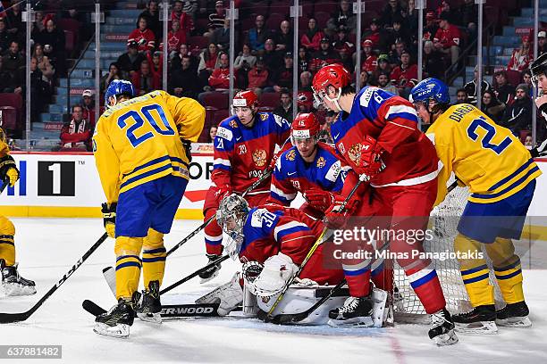 Goaltender Ilya Samsonov of Team Russia looks for the puck through traffic during the 2017 IIHF World Junior Championship bronze medal game against...