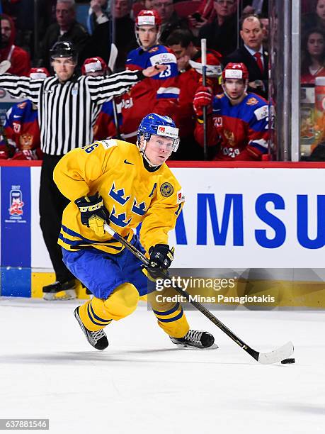 Carl Grundstrom of Team Sweden skates the puck during the 2017 IIHF World Junior Championship bronze medal game against Team Russia at the Bell...