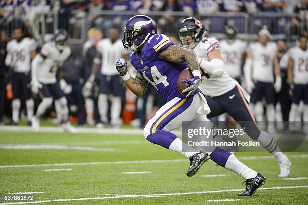 Matt Asiata of the Minnesota Vikings carries the ball against the Chicago Bears during the game on January 1, 2017 at US Bank Stadium in Minneapolis,...