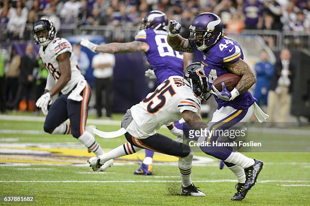 Matt Asiata of the Minnesota Vikings carries the ball against the Chicago Bears during the game on January 1, 2017 at US Bank Stadium in Minneapolis,...