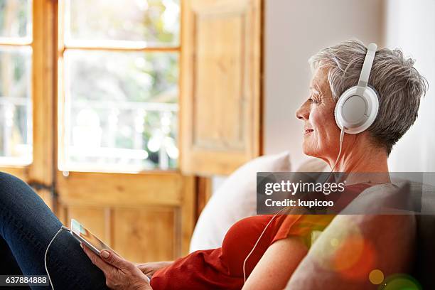 this song takes her back - listening to music old stock pictures, royalty-free photos & images