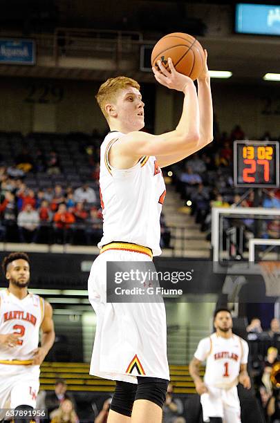 Kevin Huerter of the Maryland Terrapins shoots the ball against the Charlotte 49ers at Royal Farms Arena on December 20, 2016 in Baltimore, Maryland.