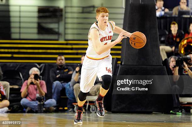 Kevin Huerter of the Maryland Terrapins handles the ball against the Charlotte 49ers at Royal Farms Arena on December 20, 2016 in Baltimore, Maryland.