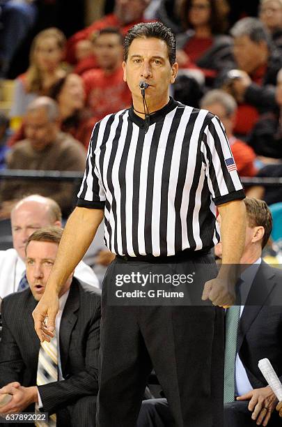 Gene Steratore officiates the game between the Maryland Terrapins and the Charlotte 49ers at Royal Farms Arena on December 20, 2016 in Baltimore,...