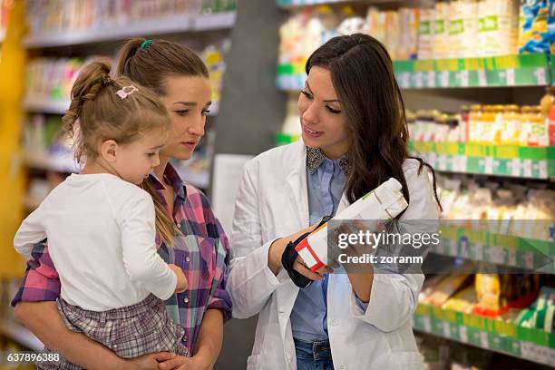 family shopping for organic groceries - juice box stock pictures, royalty-free photos & images