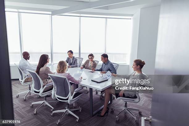 group business meeting in office conference room - future society stock pictures, royalty-free photos & images