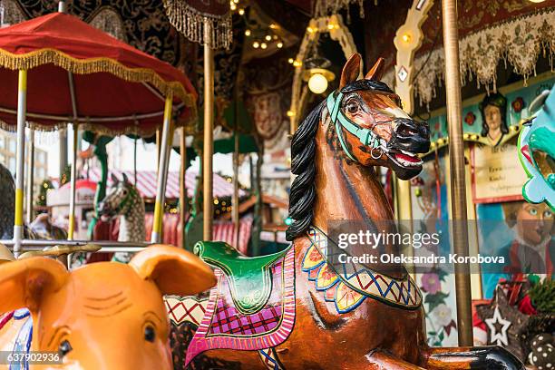 carousel at a carnival or festival. - giostra foto e immagini stock