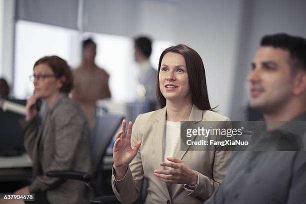 woman expressing ideas in business meeting - politics and government stock pictures, royalty-free photos & images