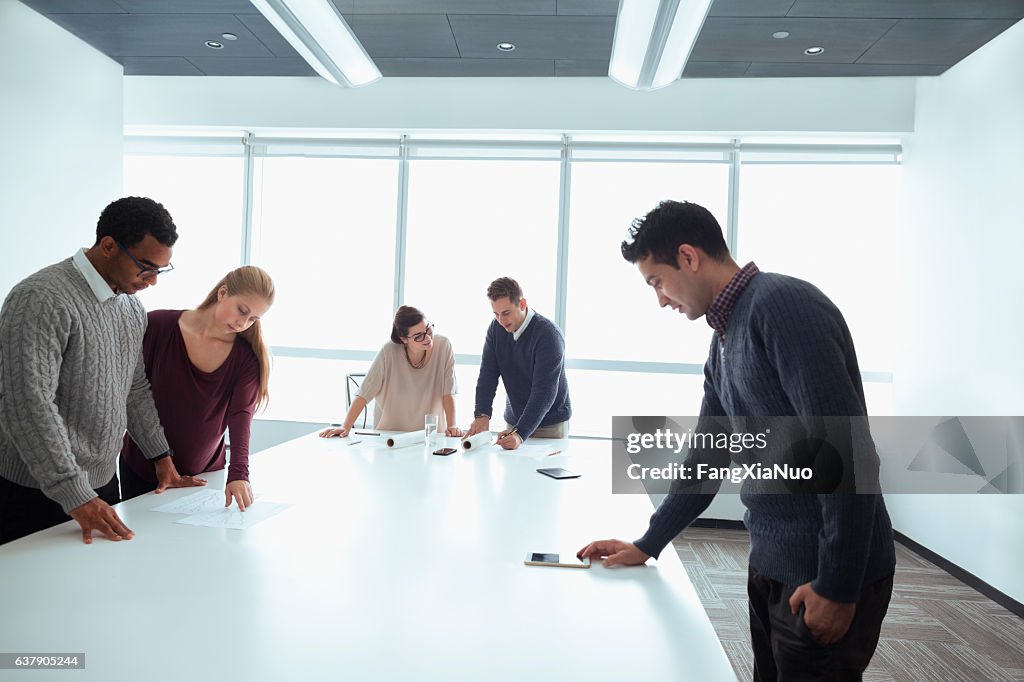 Business colleagues working together in meeting room