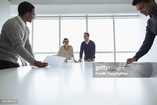 business colleagues working together in meeting room - simplicity leadership stock pictures, royalty-free photos & images