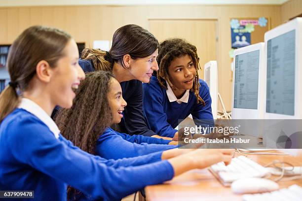 students learning computer programming - school uniform stock pictures, royalty-free photos & images