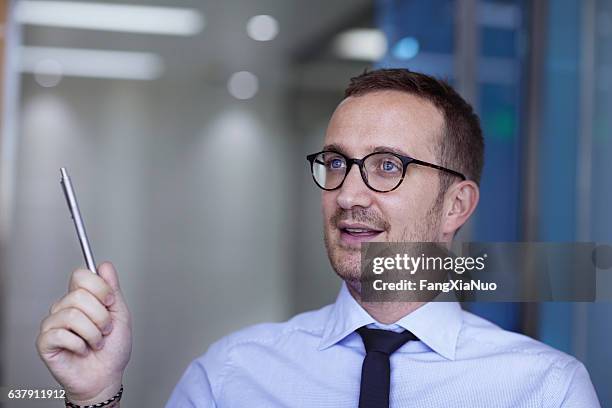 businessman talking during meeting in office - portrait choice stockfoto's en -beelden