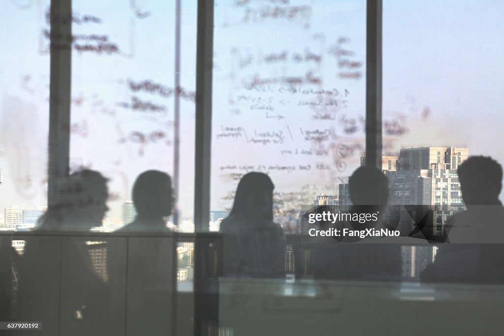Silhouette shadows of business team meeting in office