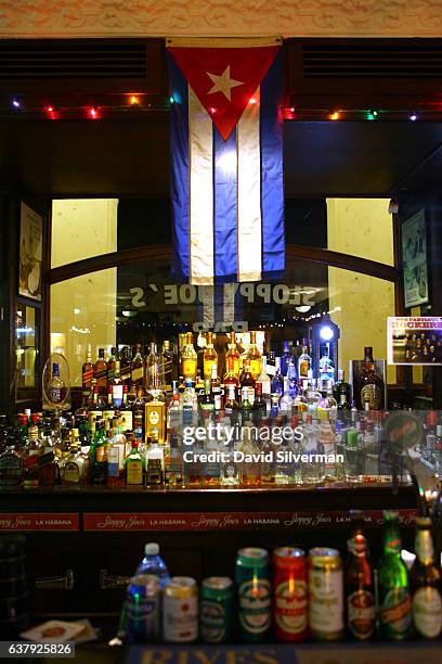 The Cuban flag adorns the bar at Sloppy Joe's, a popular restaurant which reopened in 2013 after being closed for 48 years, on December 21, 2015 in...