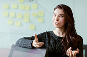 Woman discussing ideas and strategy in studio office