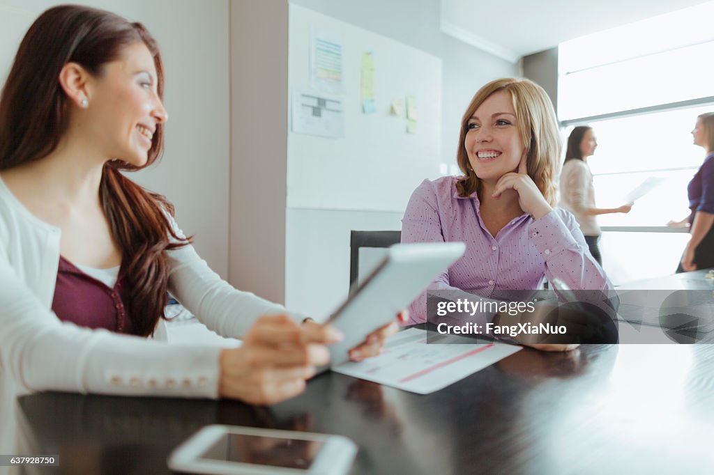 Woman talking together in design studio office