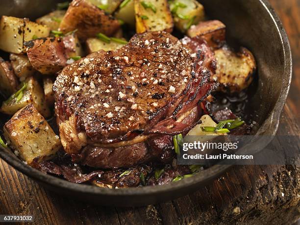 bacon wrapped steak fillets sautéed in garlic butter - juicy stock pictures, royalty-free photos & images