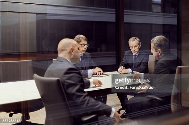 executive businessmen talking in meeting room - 排除 個照片及圖片檔