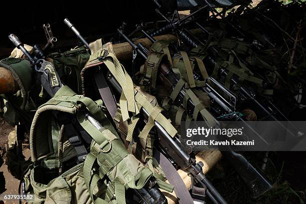 S Sixth Front automatic assault rifles seen on a rack in a demobilization camp in the final days before they are handed back to the government on...