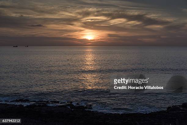 Sunset from Ponta do Sal on January 07, 2017 in Cascais, Portugal. Ponta do Sala is favored by locals and tourists who wish to watch sunset.