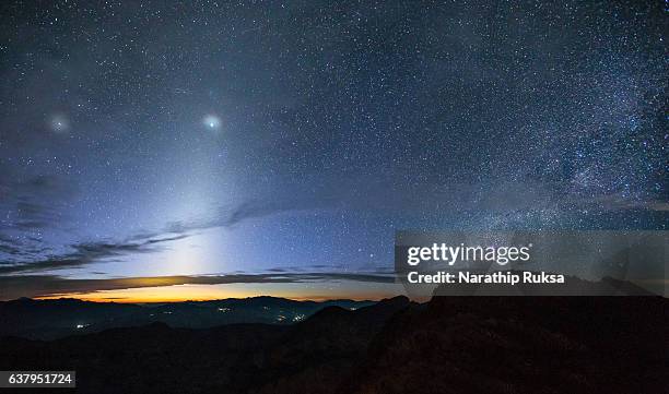 zodiacal light and the milky way over the mountain at early morning, thailand - zodiacal light stock pictures, royalty-free photos & images