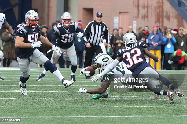 Wide Receiver Brandon Marshall of the New York Jets has a short gain against the New England Patriots at Gillette Stadium on December 24, 2016 in...