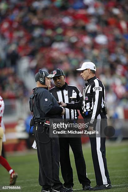 Head Coach Chip Kelly of the San Francisco 49ers talks with Official Tony Corrente on he field during the game against the Seattle Seahawks at Levi...