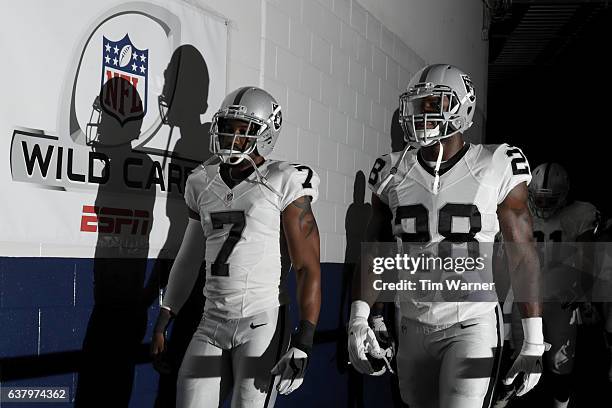 Latavius Murray of the Oakland Raiders and Marquette King walk to the locker room before the game against the Houston Texans at NRG Stadium on...