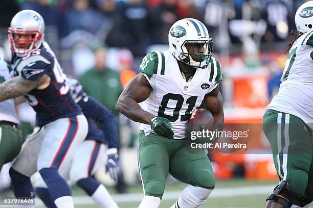 Wide Receiver Quincy Enunwa of the New York Jets has a big gain against the New England Patriots at Gillette Stadium on December 24, 2016 in Foxboro,...