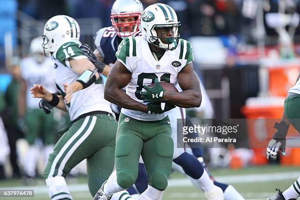 Wide Receiver Quincy Enunwa of the New York Jets has a big gain against the New England Patriots at Gillette Stadium on December 24, 2016 in Foxboro,...