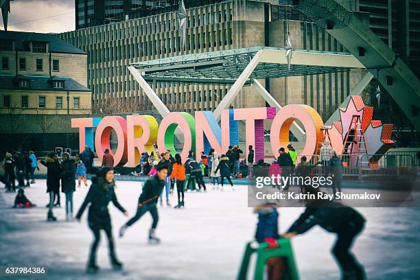 toronto winter fun on nathan phillips square - toronto winter stock pictures, royalty-free photos & images