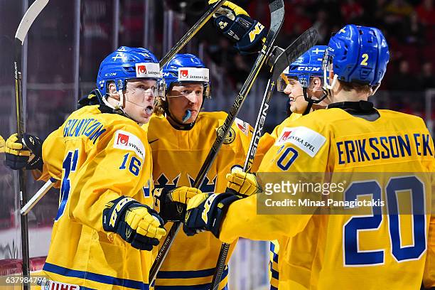 Carl Grundstrom of Team Sweden celebrates his goal with teammates during the 2017 IIHF World Junior Championship semifinal game against Team Canada...