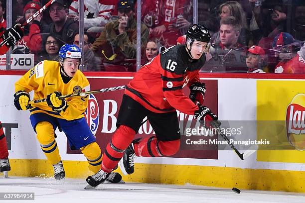 Taylor Raddysh of Team Canada skates the puck against Tim Soderlund of Team Sweden during the 2017 IIHF World Junior Championship semifinal game at...