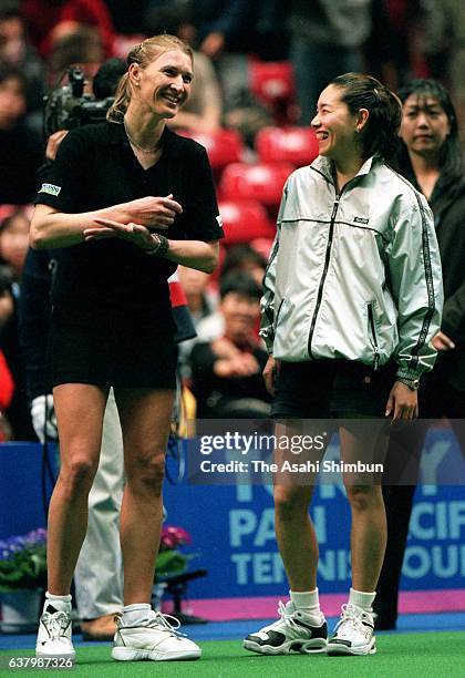 Former tennis players Steffi Graf and Kimiko Date talk after their exhibition match during day six of the Toray Pan Pacific Open at Tokyo...