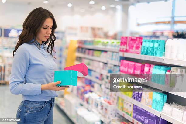 choosing tampons - femininity stock pictures, royalty-free photos & images