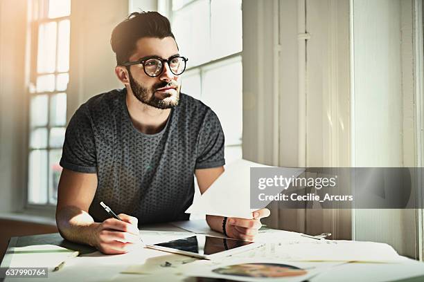 looks like a lightbulb moment - men writing stock pictures, royalty-free photos & images