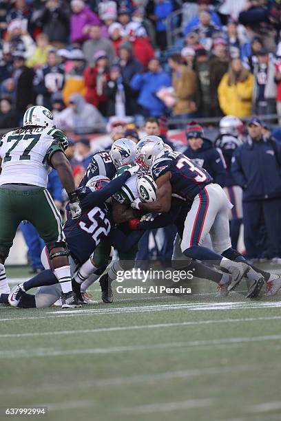 Linebacker Elandon Roberts, Linebacker Kyle Van Noy, Defensive Back Jordan Richards and Cornerback Cyrus Jones of the New England Patriots make a...