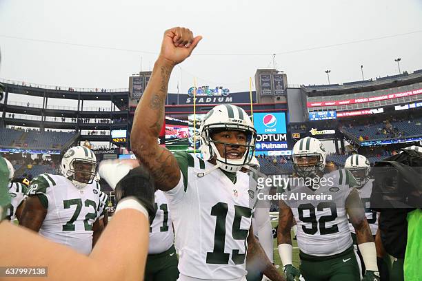 Wide Receiver Brandon Marshall of the New York Jets fires up his teammates before the game against the New England Patriots at Gillette Stadium on...