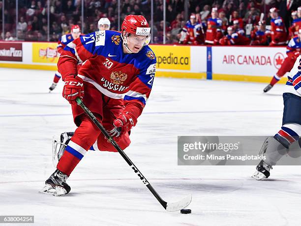 Denis Guryanov of Team Russia skates the puck during the 2017 IIHF World Junior Championship semifinal game against Team United States at the Bell...