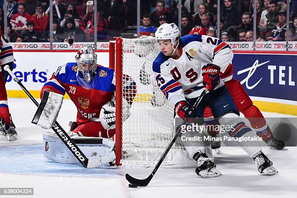 Charlie McAvoy of Team United States skates around the net of goaltender Ilya Samsonov of Team Russia during the 2017 IIHF World Junior Championship...