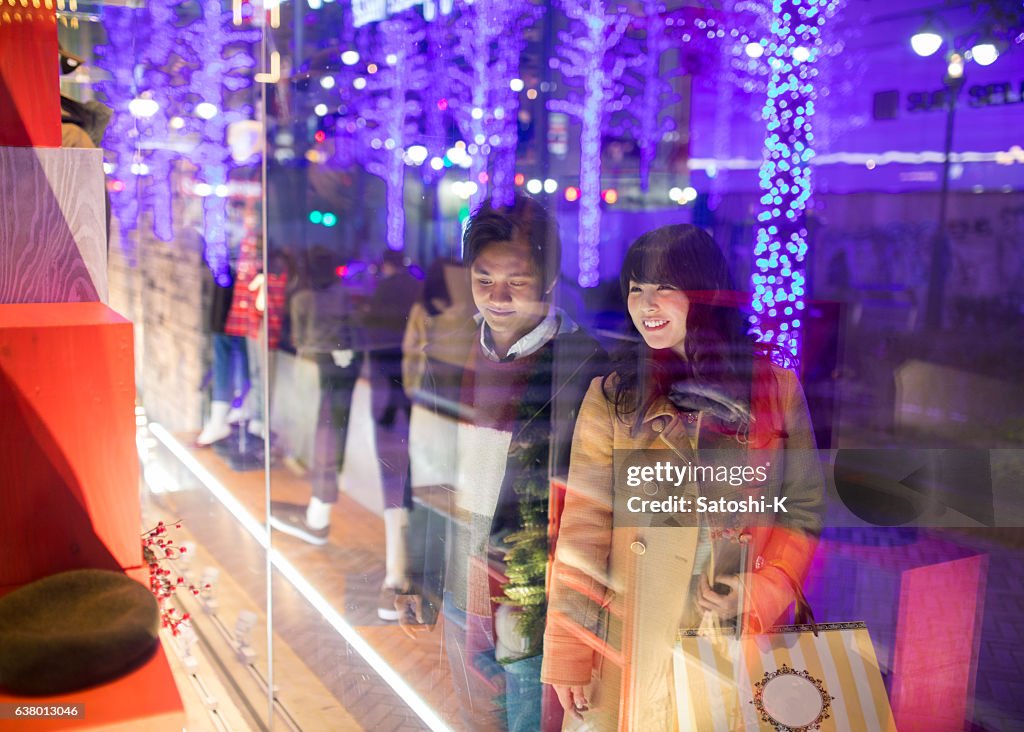 Young couple shopping at Christmas night