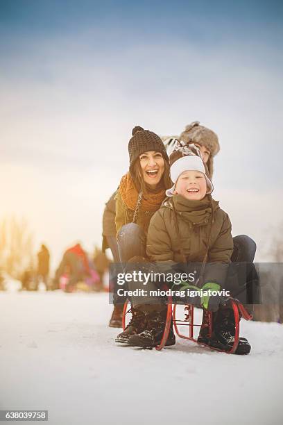 having fun on snow - nanny stock pictures, royalty-free photos & images