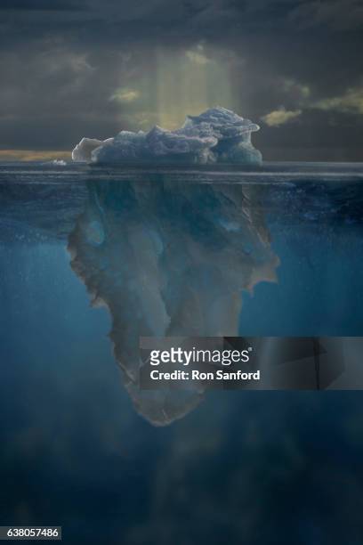 a digital composition of an ak iceberg above & below the water.. - iceberg above and below water stock pictures, royalty-free photos & images