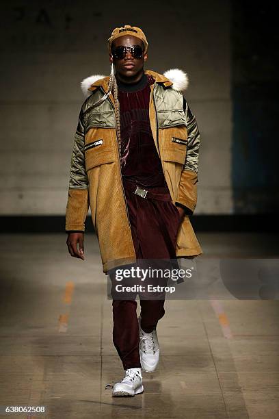 Model walks the runway at the Astrid Andersen show during London Fashion Week Men's January 2017 collections at BFC Show Space on January 7, 2017 in...