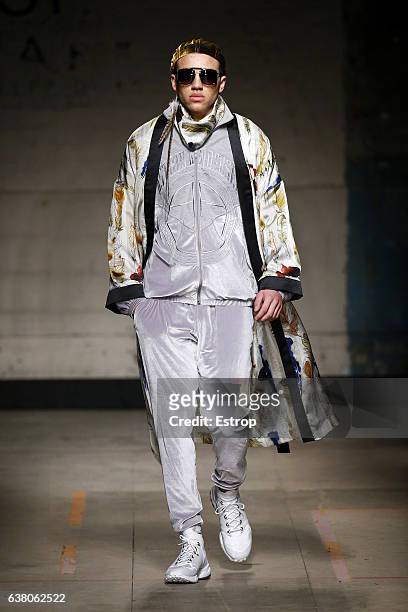 Model walks the runway at the Astrid Andersen show during London Fashion Week Men's January 2017 collections at BFC Show Space on January 7, 2017 in...