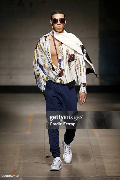 Model walks the runway at the Astrid Andersen show during London Fashion Week Men's January 2017 collections at BFC Show Space on January 7, 2017 in...