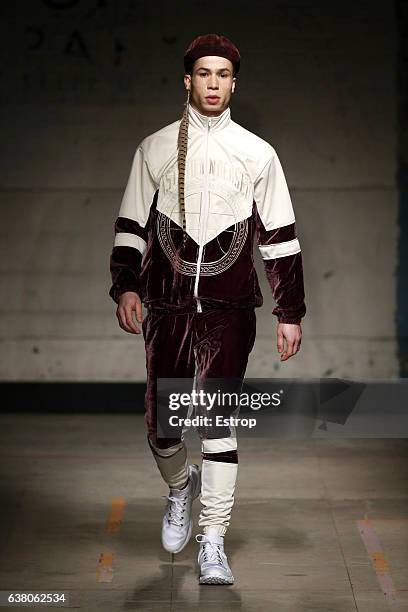 Model walks the runway at the Astrid Andersen show during London Fashion Week Men's January 2017 collections at BFC Show Space on January 7, 2017 in...