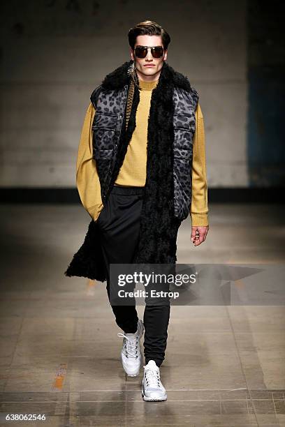 Model walks the runway at the Astrid Andersen show during London Fashion Week Men's January 2017 collections at BFC Show Space on January 7, 2017 in...