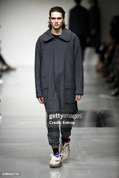 Model walks the runway at the Casely-Hayford show during London Fashion Week Men's January 2017 collections at BFC Show Space on January 7, 2017 in...